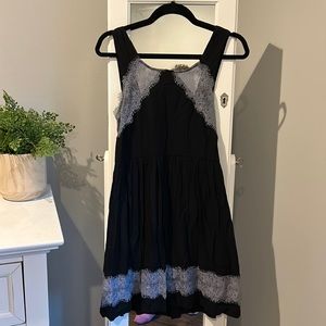 Free people size 2 black dress with beautiful lavender lace detailing.